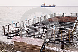 Desolated Dock On Sunset With Calm Sea