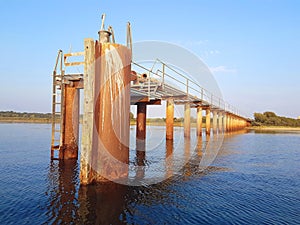 A desolated metal constructed dock at river