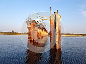 A desolated metal constructed dock at river