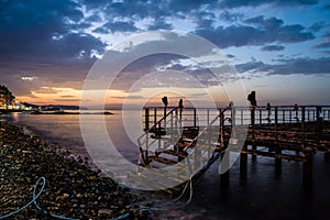 Desolated Dock On Sunset With Calm Sea