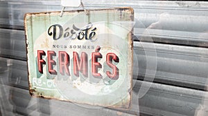 Desole nous sommes ferme french text means sorry we are closed sign board vintage board on windows shop restaurant cafe store