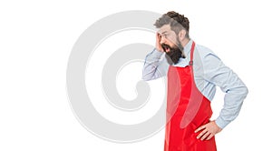 Despair professional business owner bartender grabbing head in desperation in red apron studio