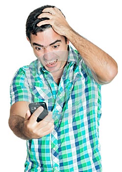 Desperate angry man looking at his mobile phone