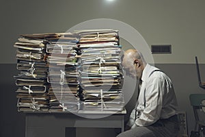 Desperate business executive with lots of paperwork