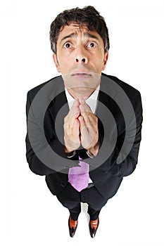 Desperate businessman praying