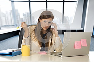 Desperate businesswoman suffering stress at office laptop computer desk