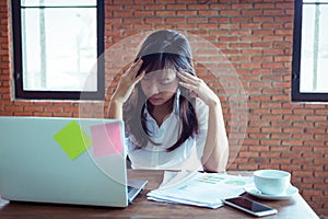 Desperate businesswoman worried in office, Asian woman headache