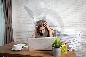 Desperate businesswoman worried in office, Asian woman headache