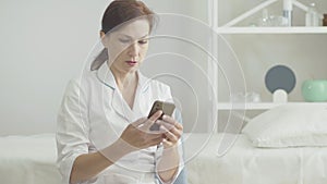 Desperate Caucasian woman calling on the phone and leaving. Portrait of depressed female doctor having no time for