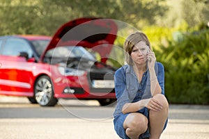 Desperate confused woman stranded with broken car engine crash accident calling on mobile phone