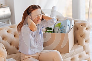 Desperate emotional woman touching her hair while screaming and crying