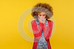 Desperate emotions. Portrait of upset woman with curly hair suffering depression, crying feeling lonely