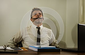 Desperate financial executive man in stress - corporate business lifestyle portrait of stressed and overwhelmed businessman