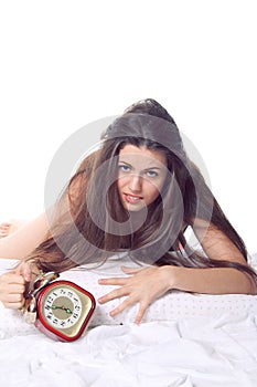 Desperate girl with old alarm clock