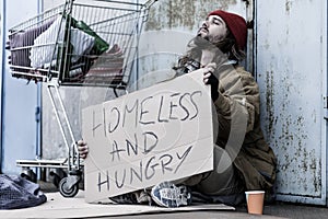 Desperate homeless and hungry tramp