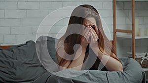 Desperate Lady Crying Suffering From Depression In Bedroom At Home