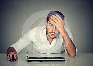 Desperate man company employee at desk