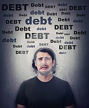 Desperate man crying, upset about huge debt amount. Dissatisfied and stressed person sobbing and weeping as has no money.