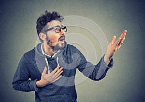 Desperate man screaming asking for help forgiveness