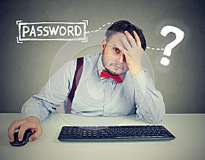 Desperate man trying to log into his computer forgot password