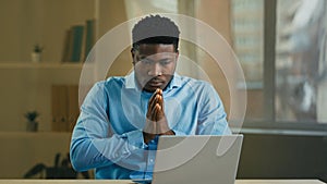 Desperate sad angry African American businessman manager entrepreneur working with laptop at office has computer problem