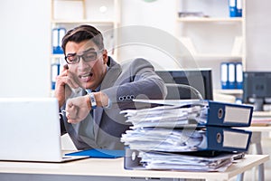 The desperate sad employee tired at his desk in call center