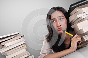 Desperate school girl looking up thinking