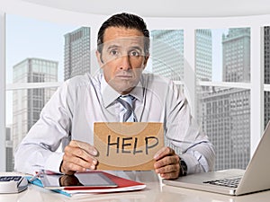 Desperate senior businessman in crisis asking for help at office in stress