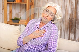 Desperate senior lady has pain in heart