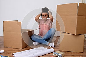 Desperate and tired woman during home relocation