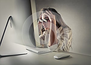 Desperate woman in front of a computer