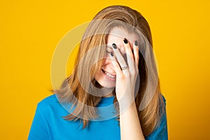 Desperate woman having depression hiding her crying face with hands