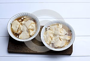 Dessert of  Bean Curd Tofu Pudding or Douhua Dou Hua  in White Bowl