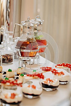 Dessert buffet with delicious sweet bakery and coffee-snack with stylish banks of lemonade and tea