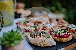 Dessert buffet at small wedding reception outside in the backyard. photo