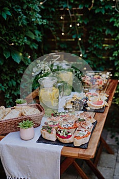 Dessert buffet at small wedding reception outside in the backyard. photo