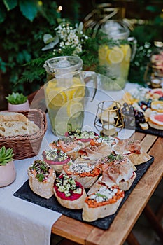 Dessert buffet at small wedding reception outside in the backyard. photo