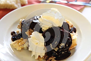 Dessert with cake and chocolate with wiped cream photo