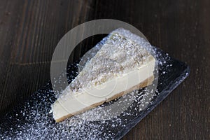 dessert cheesecake covered with dried coconut pulp