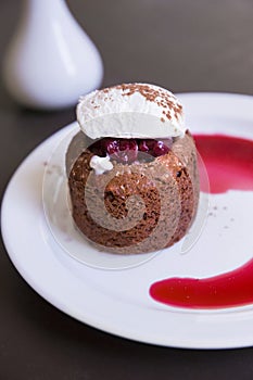 Dessert with chocolate sponge cake, cherry and vanilla ice cream