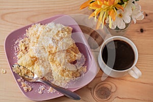 Dessert. Crackled crispy cookies with sugar on a plate and a cup of coffee on a rustic table.