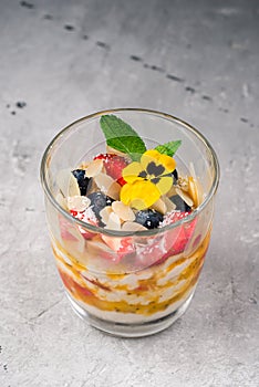 dessert with fresh berries and fruits in a glass
