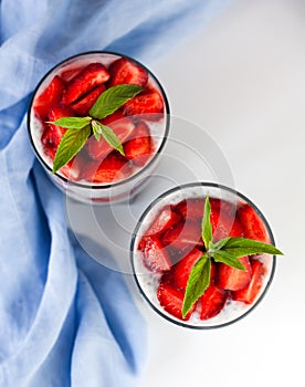 Dessert with fresh strawberry, yogurt and chia seeds. Delicious and healthy breakfast. Close-up. Top view