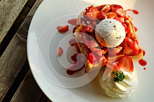 Dessert honey toast with ice cream and strawberry for romantic sweet time in valentine`s day