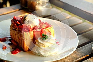 Dessert honey toast with ice cream and strawberry for romantic sweet time in valentine`s day