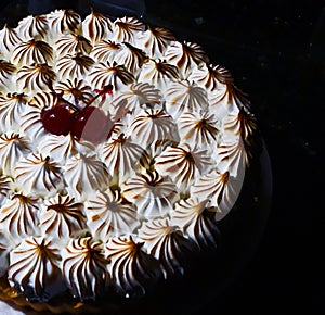 dessert, lime pie with meringue and cherries, zoom topping made with a blowtorch