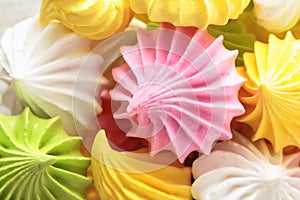 Dessert meringue made from whipped eggs and sugar on a white background. Fragility and elegance