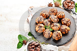 Dessert. Mini eclairs with chocolate. Baking.