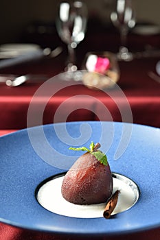 Dessert with mint leaf on plate in restaurant