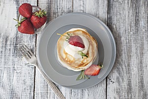 Sweet Pancakes with Cream and Strawbery. Health Breakfast Fruit Berry Vitamine Gray Rustic Wooden Background